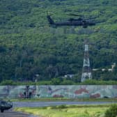 A Taiwanese military UH-60 black hawk helicopter takes off during a live-fire drill on August 09, 2022 in Pingtung, Taiwan. Taiwan's military held a live-fire drill in response to China's recent live-fire drills in waters close to those claimed by Taiwan. (Photo by Annabelle Chih/Getty Images)