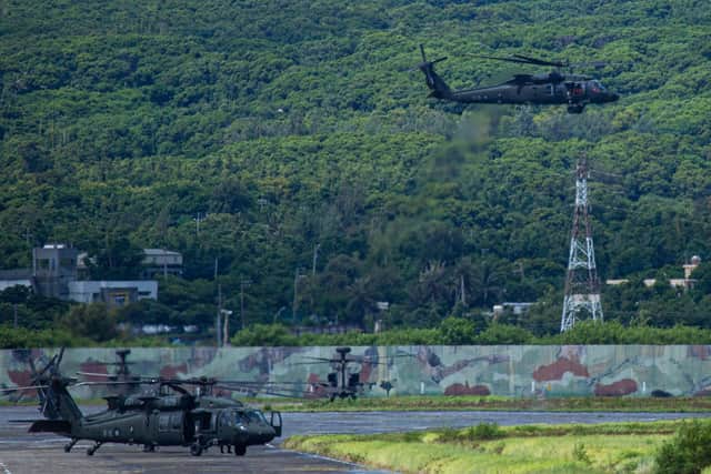 A Taiwanese military UH-60 black hawk helicopter takes off during a live-fire drill on August 09, 2022 in Pingtung, Taiwan. Taiwan's military held a live-fire drill in response to China's recent live-fire drills in waters close to those claimed by Taiwan. (Photo by Annabelle Chih/Getty Images)