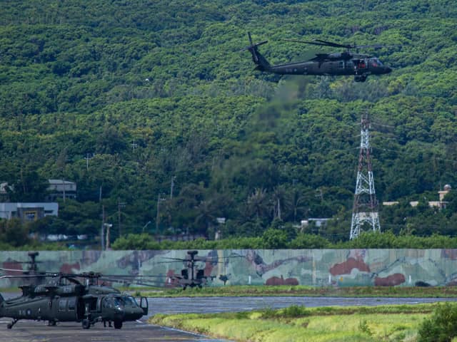 A Taiwanese military UH-60 black hawk helicopter takes off during a live-fire drill on August 09, 2022 in Pingtung, Taiwan. Taiwan's military held a live-fire drill in response to China's recent live-fire drills in waters close to those claimed by Taiwan. (Photo by Annabelle Chih/Getty Images)
