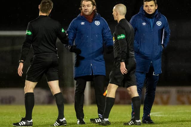 Hearts manager Robbie Neilson spoke with referee Steven McLean at half-time.