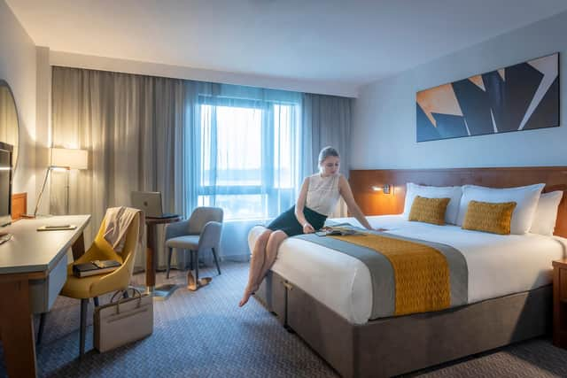 One of the bedrooms, with trademark splashes of yellow in the decor.