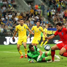 Georgiy Bushchan of Ukraine and Harry Maguire of England battle for possession. (Photo by Maja Hitij/Getty Images)