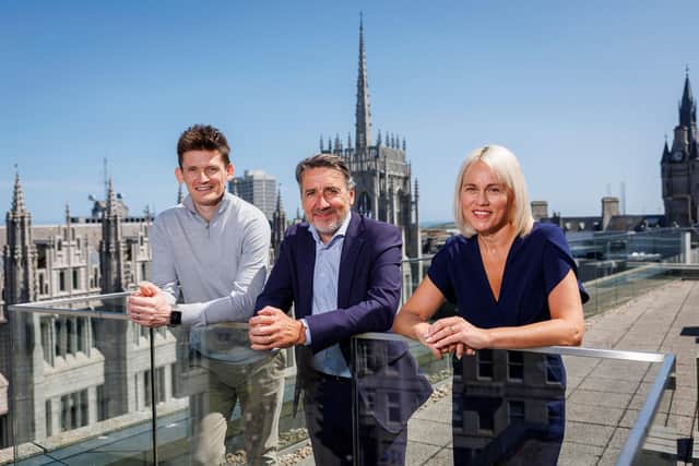 Blackadders' Joint Managing Partners Ryan McKay and Emma Gray either side of Neil Robb.