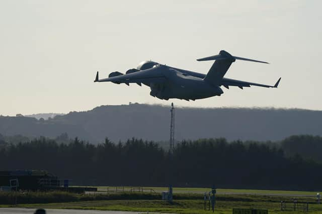 An RAF aircraft carrying the Queen's coffin takes off from Edinburgh Airport. Picture: Andrew Milligan/PA Wire