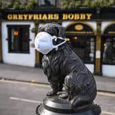 Even Greyfriars Bobby in Edinburgh was wearing a face mask as the country went into lockdown for the first time