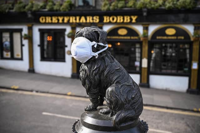 Even Greyfriars Bobby in Edinburgh was wearing a face mask as the country went into lockdown for the first time