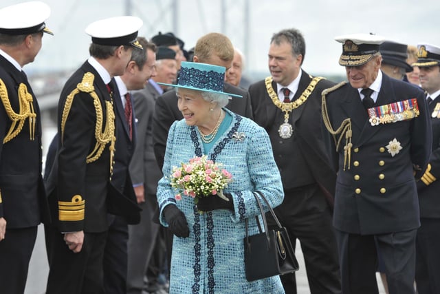 Her Majesty The Queen and Prince Philip visiting the viewing area of the Forth Road Bridge in 2014 to unveil a new plaque marking the 50th anniversary of her opening the bridge.