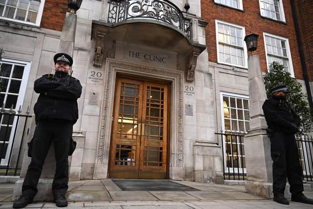 Police officers stand guard at the entrance to The London Clinic. Photo: Leon Neal/Getty Images