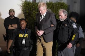 Alex Murdaugh is led outside the Colleton County Courthouse by sheriff's deputies after being convicted of two counts of murder.