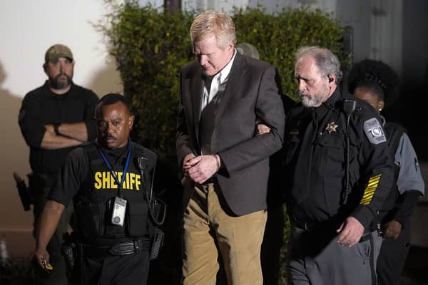 Alex Murdaugh is led outside the Colleton County Courthouse by sheriff's deputies after being convicted of two counts of murder.