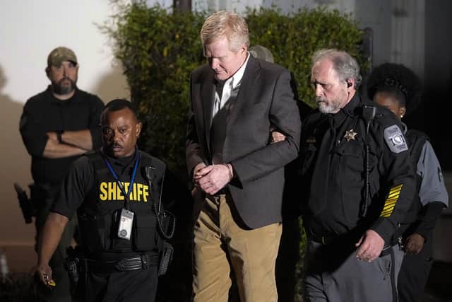 Alex Murdaugh is led outside the Colleton County Courthouse by sheriff's deputies after being convicted of two counts of murder.