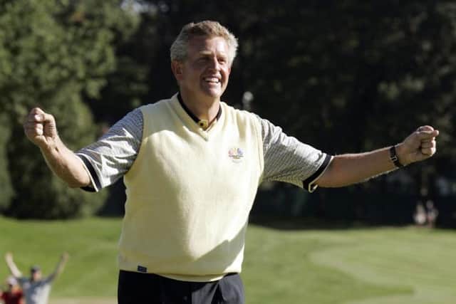 Colin Montgomerie reacts to sinking the winning putt in the 2004 Ryder Cup at Oakland Hills Cin Detroit. Picture: Timothy A. Clary/AFP via Getty Images.