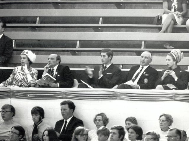 Prince Charles applauds athletes from the Royal Box.
