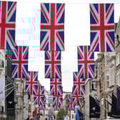 A view of Bond Street as it is decorated with 247 Union flags to celebrate King Charles III's Coronation. Issue date: Thursday April 27, 2023.