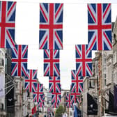 A view of Bond Street as it is decorated with 247 Union flags to celebrate King Charles III's Coronation. Issue date: Thursday April 27, 2023.