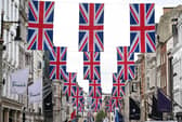 A view of Bond Street as it is decorated with 247 Union flags to celebrate King Charles III's Coronation. Issue date: Thursday April 27, 2023.