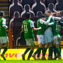 The Hibs' players celebrate Martin Boyle opening the scoring at Motherwell.