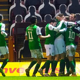 The Hibs' players celebrate Martin Boyle opening the scoring at Motherwell.