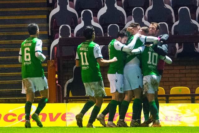 The Hibs' players celebrate Martin Boyle opening the scoring at Motherwell.