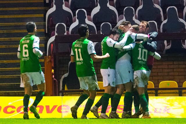 The Hibs' players celebrate Martin Boyle opening the scoring at Motherwell.