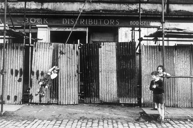 A girl swinging from scaffolding on a rope in Edinburgh in 1965. Picture: Robert Blomfield