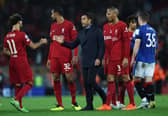 Mohamed Salah of Liverpool interacts with Giovanni van Bronckhorst, Manager of Rangers after the UEFA Champions League group A match between Liverpool FC and Rangers FC at Anfield on October 04, 2022 in Liverpool, England. (Photo by Clive Brunskill/Getty Images)