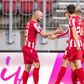 St Johnstone's players celebrate after Chris Kane opened the scoring against LASK in Austria (Photo by JOHANN GRODER/EXPA/AFP via Getty Images)