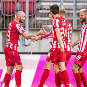 St Johnstone's players celebrate after Chris Kane opened the scoring against LASK in Austria (Photo by JOHANN GRODER/EXPA/AFP via Getty Images)