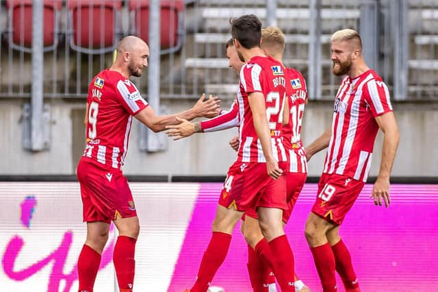 St Johnstone's players celebrate after Chris Kane opened the scoring against LASK in Austria (Photo by JOHANN GRODER/EXPA/AFP via Getty Images)