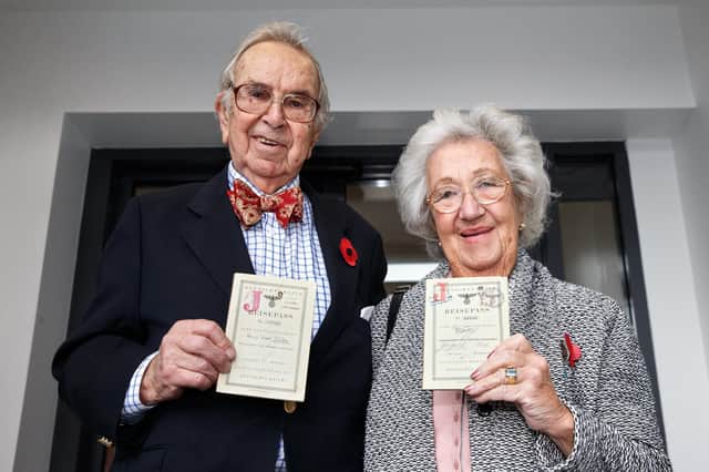 Henry Wuga and his late wife Ingrid Wuga with their Kindertransport passes, stamped in 1939 (Picture: Robert Perry)