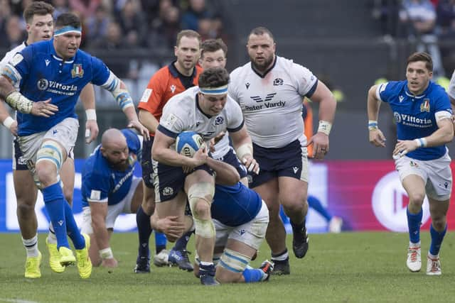 Co-captain Rory Darge tries to break through the Italian defence in Rome.