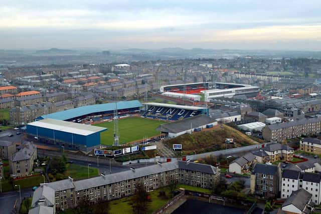 Angus Cook wanted a merged Dundee team to play at Dens Park (foreground)
