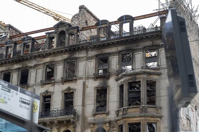 Part of Princes Street still remains closed to the pubic and traffic after a fire broke out in the former Debenhams building
