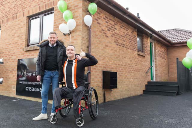 Gary and Ian outside his new home. Picture: Cameron Allan.