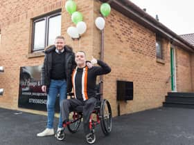Gary and Ian outside his new home. Picture: Cameron Allan.