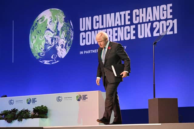 Prime minister Boris Johnson walks off the stage after addressing the COP26 opening ceremony. Picture: Jeff J Mitchell / Pool/AFP/Getty