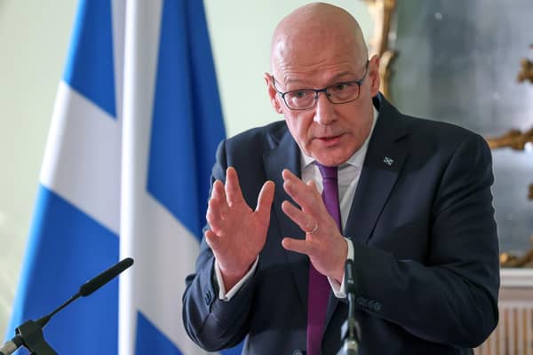 First Minister John Swinney.