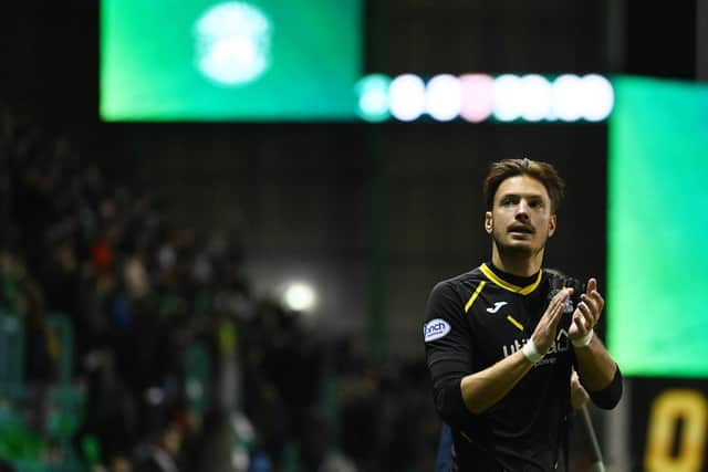 Kevin Dabrowski applauds the Hibs support after making his competitive debut in the 0-0 draw with Hearts on Tuesday.  (Photo by Paul Devlin / SNS Group)