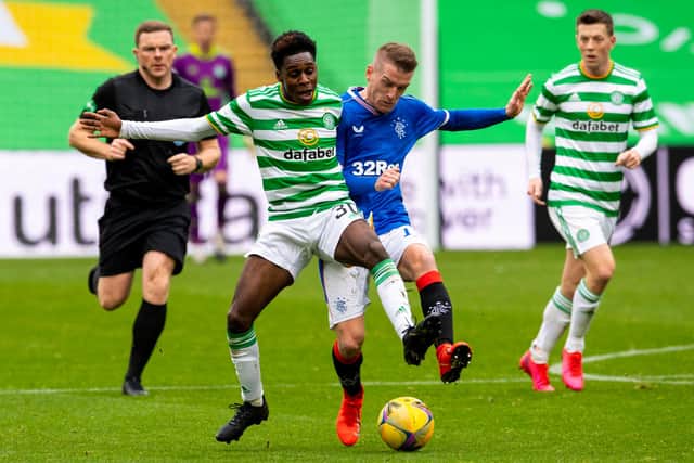 Steven Davis competes with Jeremie Frimpong in the Old Firm clash.
