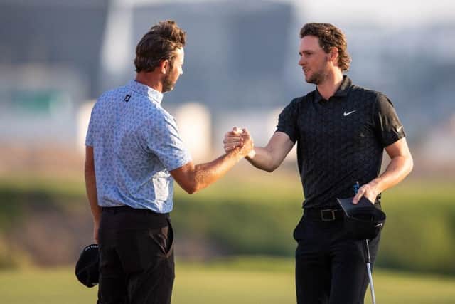 Scott Jamieson, left, congratulates Thomas Pieters after the final round of last year's Abu Dhabi HSBC Championship at Yas Links. Picture: Ryan Lim/AFP via Getty Images.