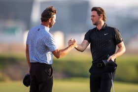 Scott Jamieson, left, congratulates Thomas Pieters after the final round of last year's Abu Dhabi HSBC Championship at Yas Links. Picture: Ryan Lim/AFP via Getty Images.