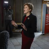 First Minister Nicola Sturgeon talks with the gathered media following First Minister's Questions at the Scottish Parliament