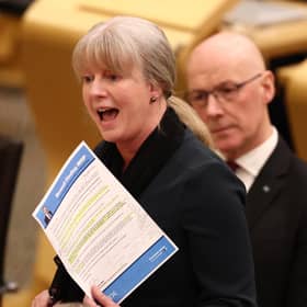 First Minister John Swinney looks on as Finance Secretary Shona Robison presents the government's Budget. Picture: Jeff J Mitchell/Getty Images