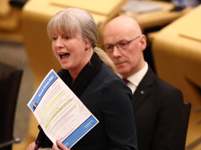First Minister John Swinney looks on as Finance Secretary Shona Robison presents the government's Budget. Picture: Jeff J Mitchell/Getty Images