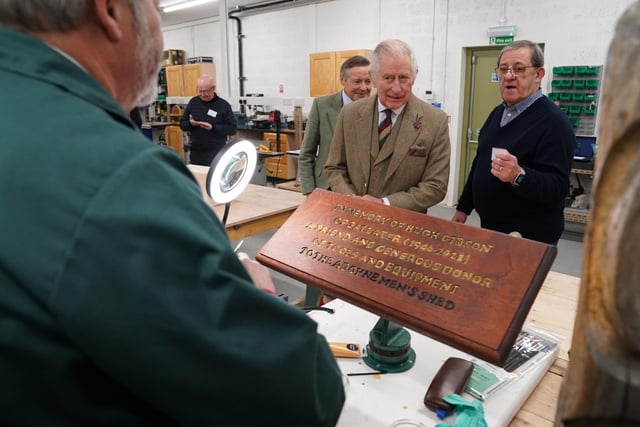 King Charles learns about how the plaques were made.