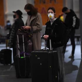 Travellers wait for trains on the concourse at King's Cross train station. Pic: Victoria Jone/PA Wire