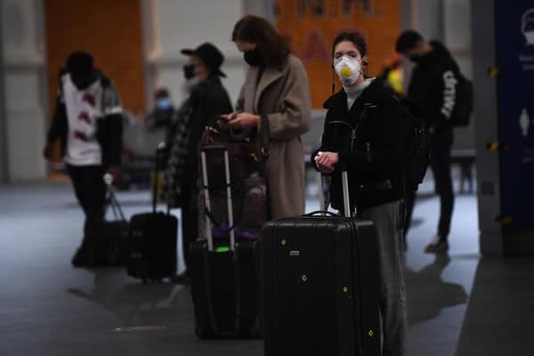 Travellers wait for trains on the concourse at King's Cross train station. Pic: Victoria Jone/PA Wire