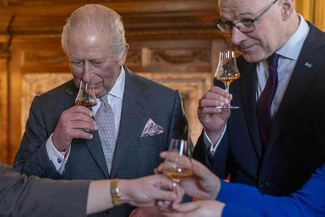 King Charles and First Minister of Scotland John Swinney try some Scotch whisky at a recent event (Picture: Jane Barlow -Pool/Getty Images)