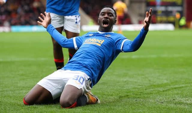 Rangers striker Fashion Sakala slides in celebration of the second of his three goals in the 6-1 win over Motherwell at Fir Park on Sunday. (Photo by Craig Williamson / SNS Group)