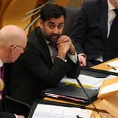 Health secretary Humza Yousaf speaks to Deputy First Minister John Swinney during First Minister's Questions. Picture: Andrew Milligan/PA Wire
